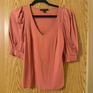 Women's coral top with sleeve detail